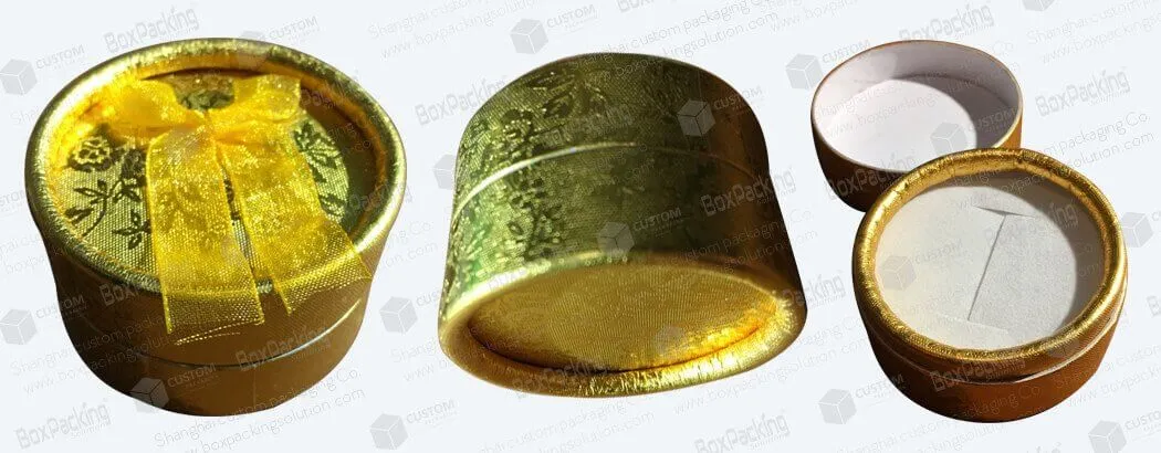 small round gold cardboard tubes
